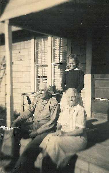 Mr. Reaves, Charley Annie McKay Temple Reaves and the little girl is Mary Jo Cronin ( Daughter of Clarence Cronin and Nancy (Nanny) E. Workman Cronin. 