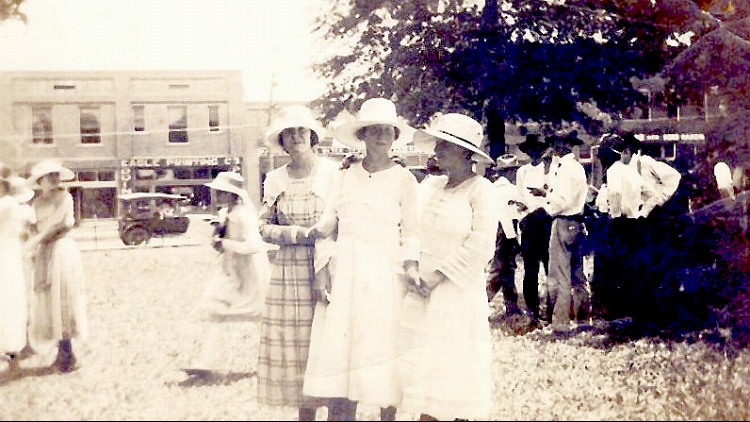 Unknown ladies across the street from the Eagle Printing Company - Can you help identify these ladies?