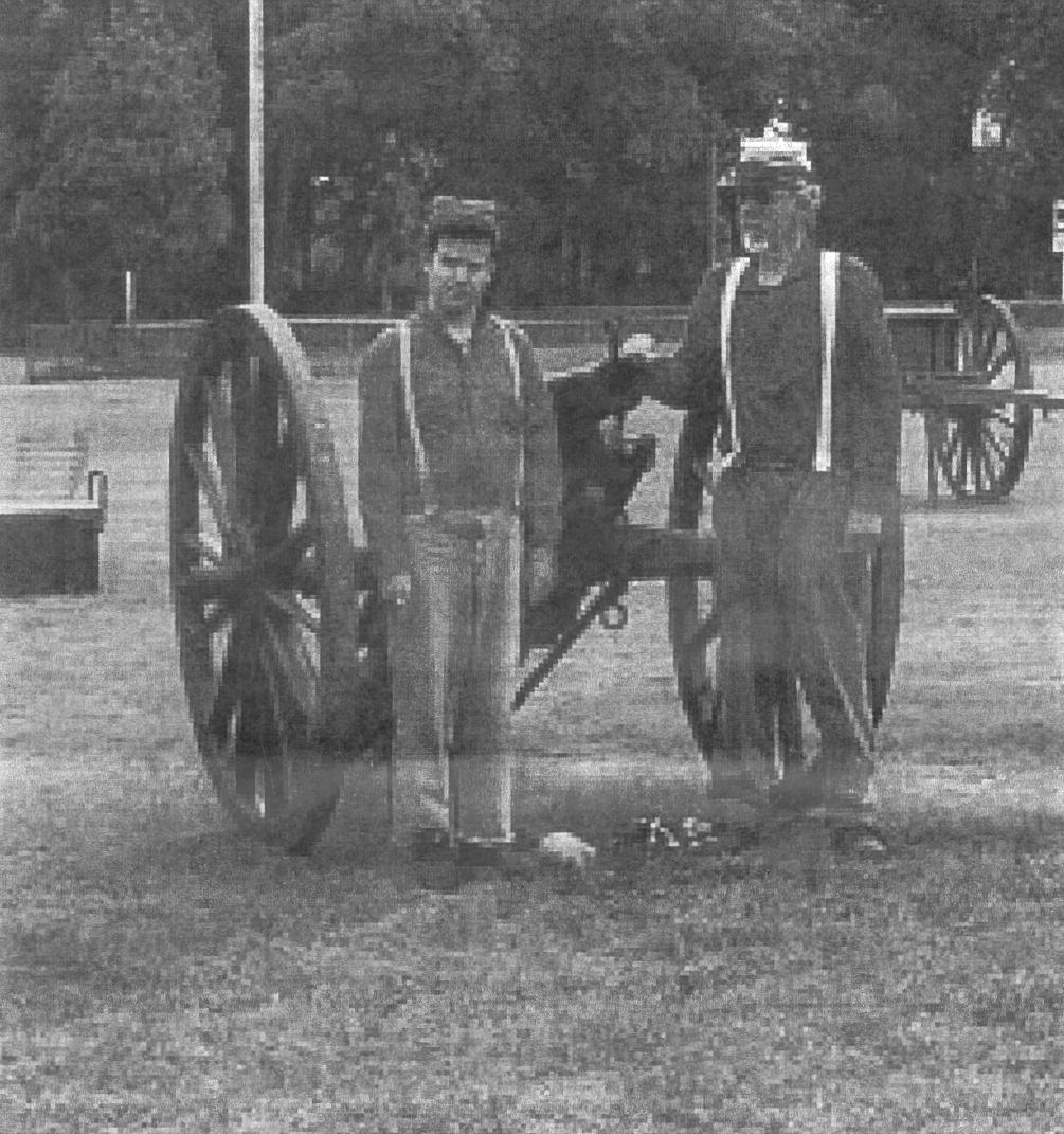 Men grouped around a cannon