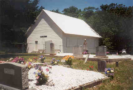 Buckville Church is covered with siding. June 2001.  The Robbins foreground.