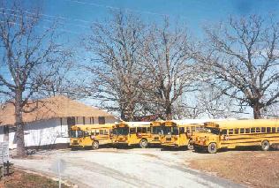 Oden School buses with the Agri Building to the left. March 2001.