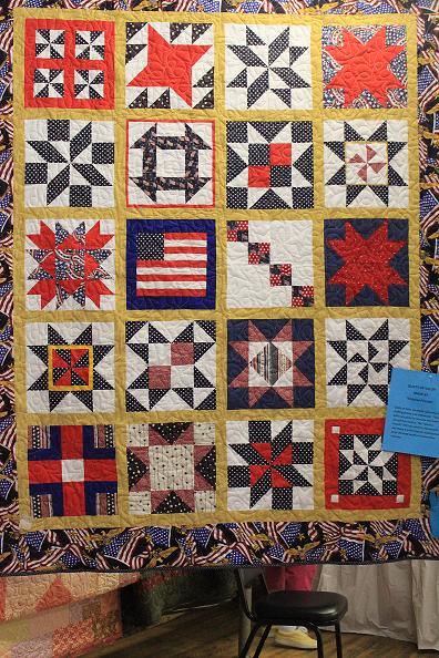 Quilt of Valor - A PATTERN OF GIVING. It is also a sampler quilt in which each block is different. It is a good way to learn to quilt because you learn a variety of piecing methods. 