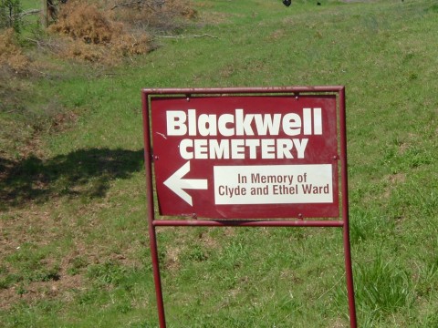 Red & white sign photo, in memory of clyde & ethel ward