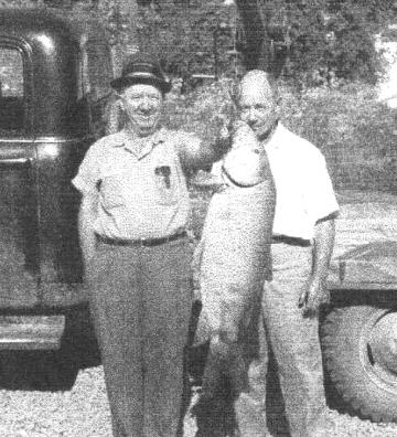 White County Historical Society treasurer Leon Van Patten (right) and
George Flowers display a 70-pound drum caught by Ed Hoy on Little Red River in
the late 1950s