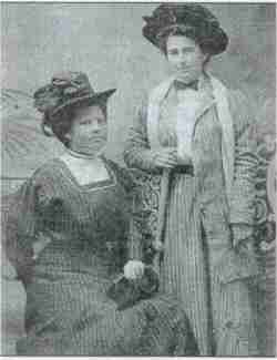 Iris Eaker Dennis (standing) in 1910 with Rosa Matthews Alford