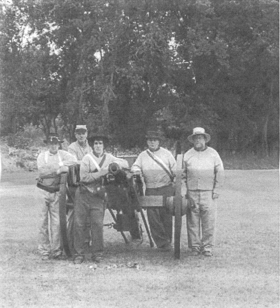 Men grouped around a cannon