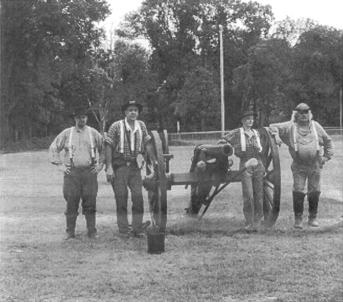 Men grouped around a cannon